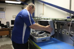 Bill, Production Lead, inspecting 5000th Bonder, HEATCON Composite Systems, Composite Repair, 2017